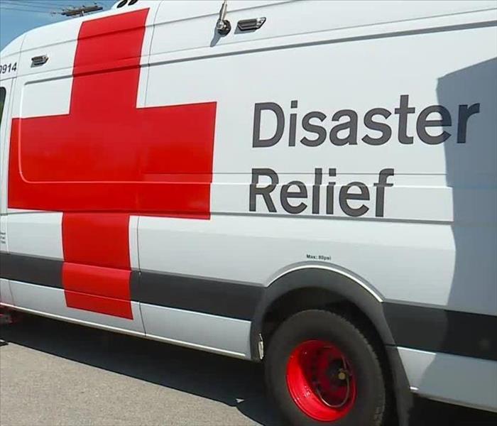 American Red Cross white van with a red cross 