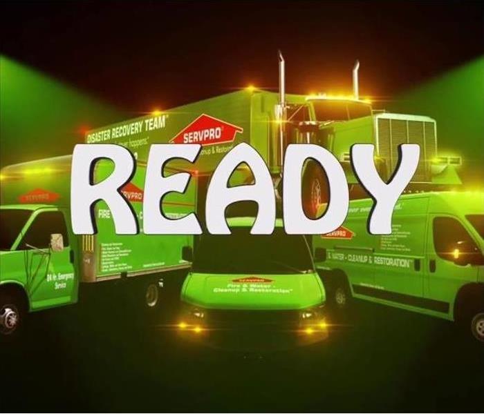 Green SERVPRO trucks in the night with caption, "Ready." 